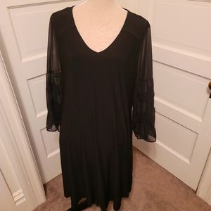 Little black dress with sheer sleeves
